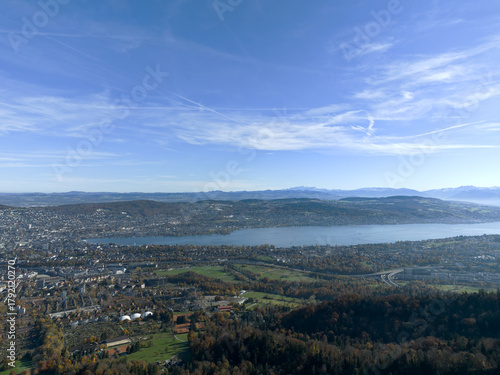 Aerial view of beautiful Swiss autumn landscape with city of Zürich seen from local mountain Uetliberg on a sunny autumn day. Photo taken October 29th, 2025, Zurich Uetliberg, Switzerland.