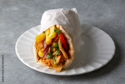 Greek chicken gyros wrapped in pita breads