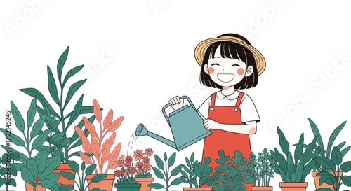 A cheerful young girl in a straw hat and red overalls happily watering plants in a garden with a watering can.
