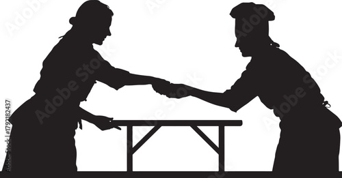 Silhouette of two chefs exchanging an item over a table black