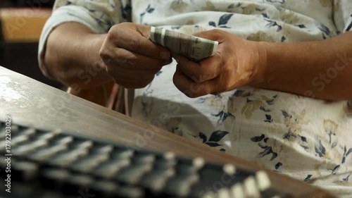 Indian Man Counting ₹500 Notes Before Laptop, Offering Salary to Employee