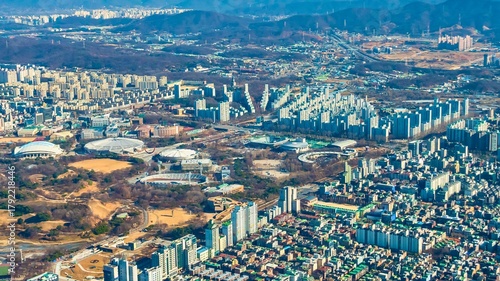 Expansive aerial view of a densely populated cityscape with apartment buildings