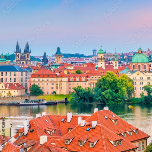 Prague cityscape with vltava river and historic architecture at dusk
