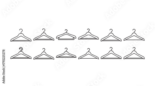 Collection of twelve wooden clothes hangers in a simple line silhouette