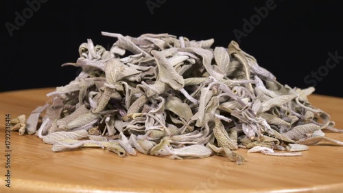 Close-up footage of dried sage on black background.