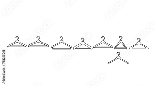 Collection of simple outline clothing hangers arranged in a line silhouette