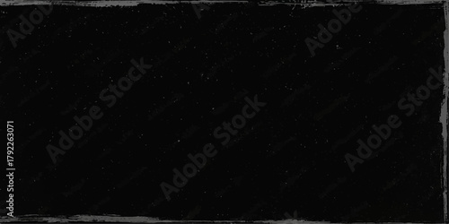 Abstract dark black and white paper texture background with a light flash and hints of night sky space