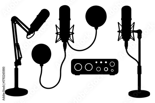 Silhouette of microphone setup with boom arms and audio interface.