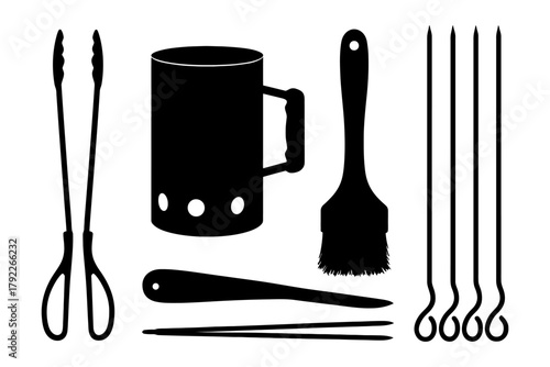 Barbecue tools set with kebab skewers, tongs, basting brush, and chimney starter.