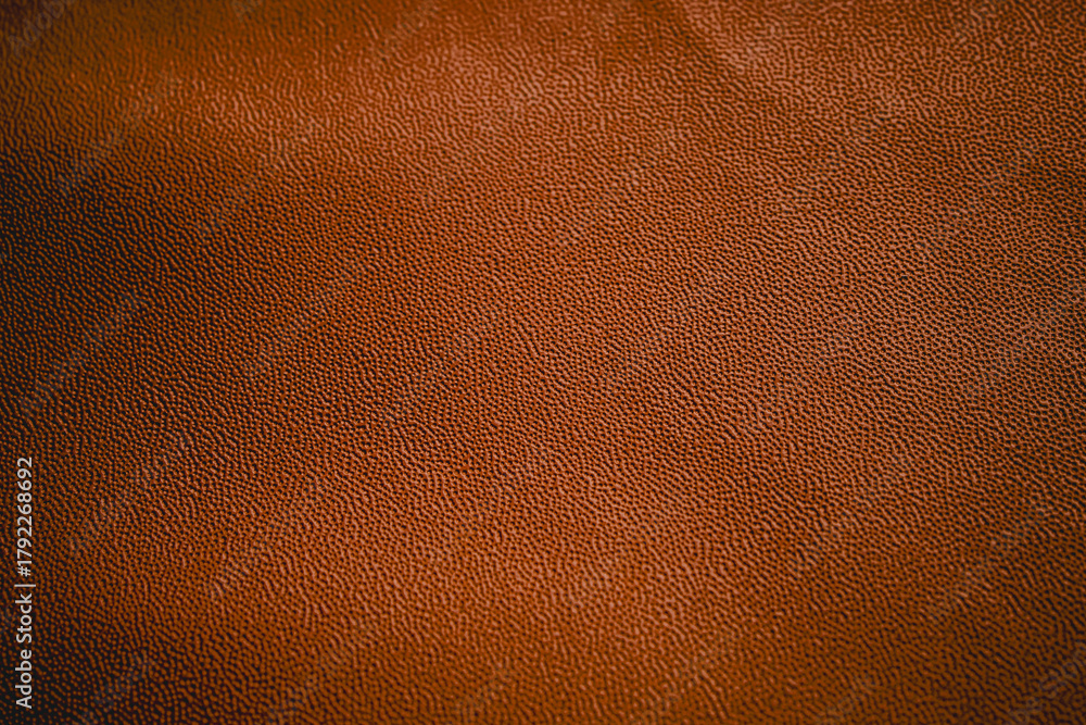 Fototapeta premium brown leather texture with small, even grains. brown leather material background