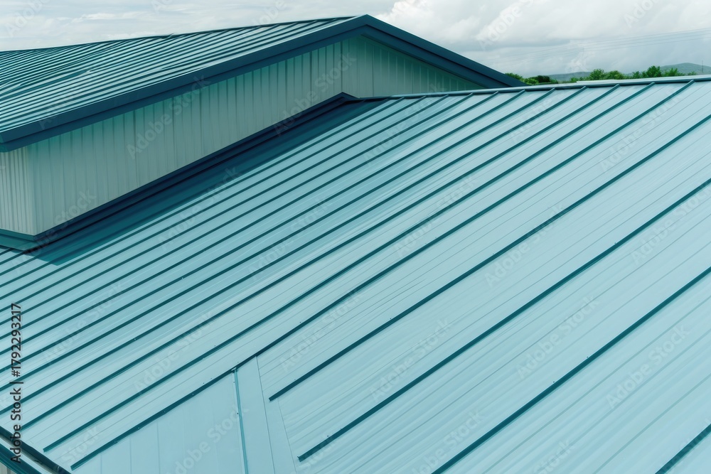 Fototapeta premium Light blue steel roof with focused side edges, sleek lines, modern design and clear sky background for architectural and construction use