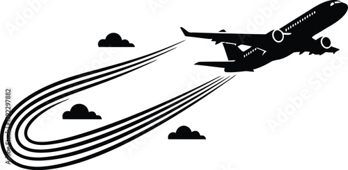 Airplane silhouette flying with a distinct contrail in sky