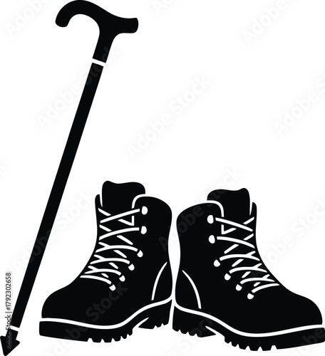Hiking boots silhouette with walking stick