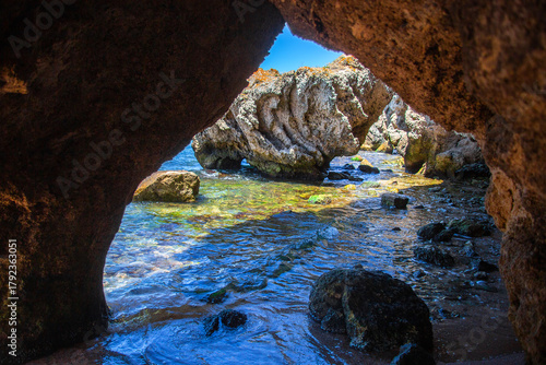 A mysterious view from a cave on the seashore. Grotto on the beach of the Sea of Azov