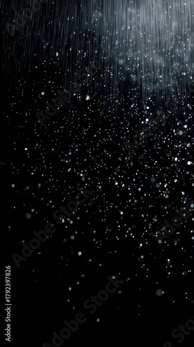 Gentle rain falls softly, creating a serene atmosphere on a dark night