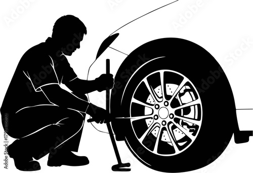 Mechanic Replacing Tire in Silhouette A Symbol of Automotive Maintenance and Service