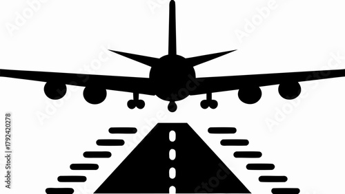 Commercial airplane descending towards runway lights, ready for landing.