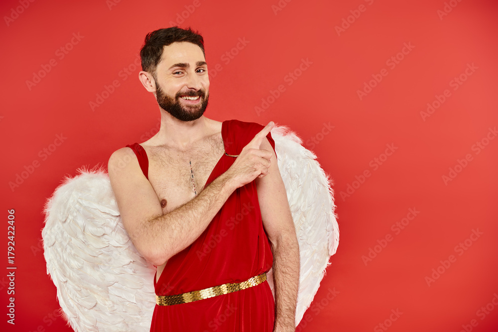 Fototapeta premium Cupid spreads love on Valentines Day dressed in red with fluffy wings
