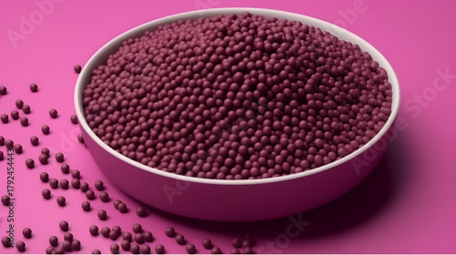 Bowl filled with burgundy spheres on a matching background,  creating a visually appealing and monochromatic composition for various designs