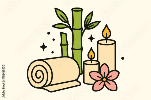 Relaxing spa elements with bamboo candles and rolled towel