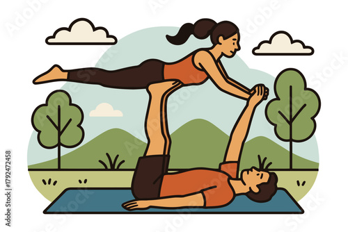 Couple practicing acro yoga together outdoors on a mat