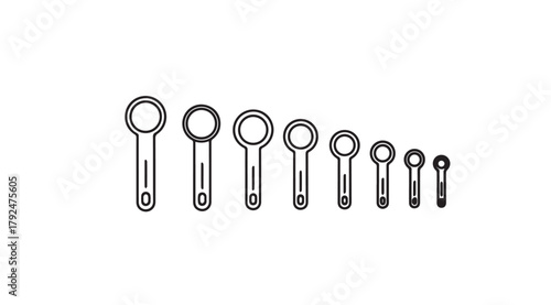 Set of measuring spoons in a descending size order silhouette
