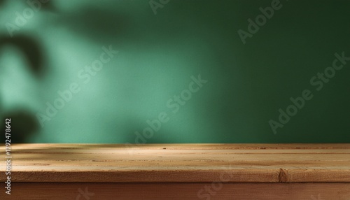Wallpaper Mural Wood table on dark green texture wall background. Composition with leaves shadow on the wall and light reflections. Mock up for presentation, branding products, cosmetics food or jewelry. Torontodigital.ca