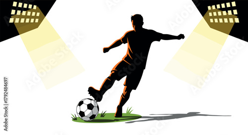 Silhouette of soccer player kicking ball under stadium lights