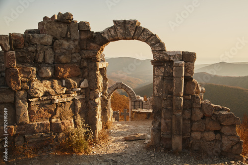 Ancient ruins of the Genoese Storm Gate Fortress overlooking the picturesque Gelendzhik Bay on the Black Sea coast, a historic landmark.