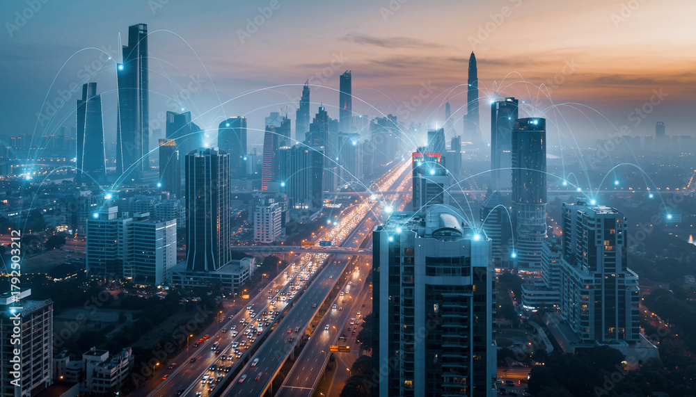 Fototapeta premium A cityscape with a highway running through it, illuminated by artificial lights and connected by digital network lines.