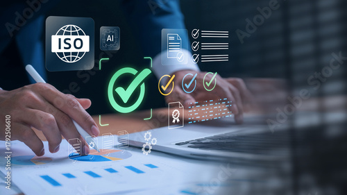 ISO certification and quality compliance concept. businessman reviewing audit documents on laptop, focusing on digital checklist, performance validation, and process improvement for standard assurance