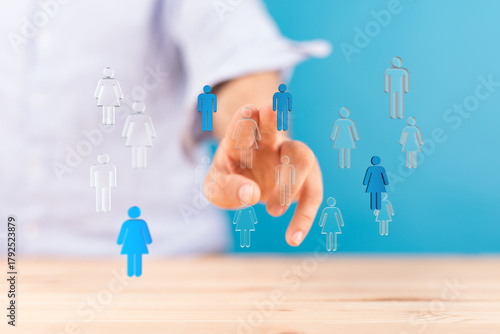 Hand pointing at blue figur...