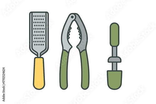 Essential kitchen utensils collection featuring a cheese grater, nutcracker, and manual juicer