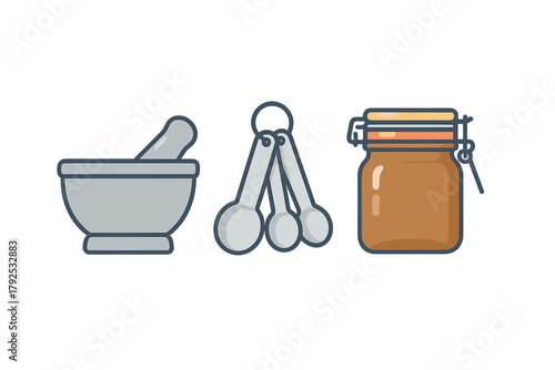 Essential kitchen tools set featuring mortar and pestle, measuring spoons, and a storage jar