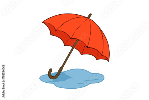 Bright orange umbrella protecting against the rain standing over a blue puddle