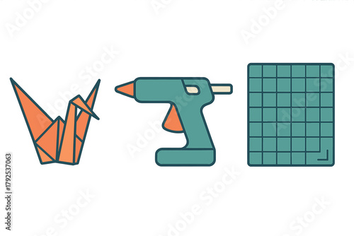 Set of crafting tools and supplies including origami crane and hot glue gun