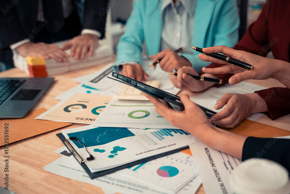 Naklejka premium Businessman and team analyzing statistics with documents and graphs. Accounting consultant dealing with data, budget and profit chart for company. Close up.