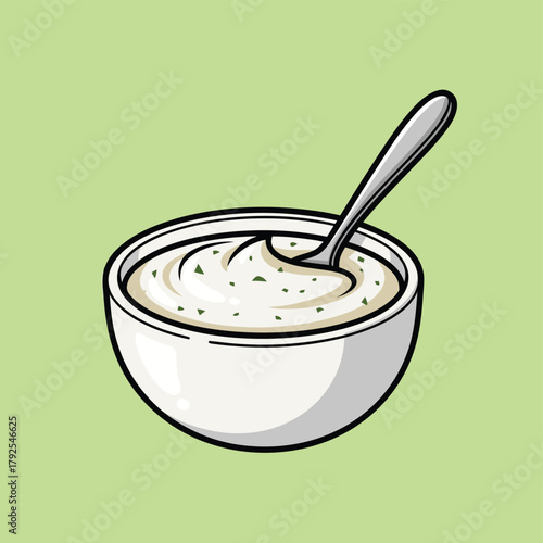 A cartoon illustration of a white bowl filled with creamy white dip or sauce with green specks and a spoon, on a light green background.