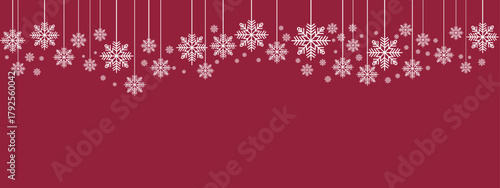 Festive holiday border/banner with white hanging snowflakes of varying sizes suspended by thin lines against a deep red background. Simple, elegant design suitable for Christmas, New Year