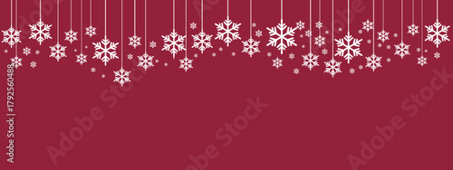 Festive holiday border/banner with white hanging snowflakes of varying sizes suspended by thin lines against a deep red background. Simple, elegant design suitable for Christmas, New Year
