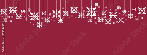 Festive holiday border/banner with white hanging snowflakes of varying sizes suspended by thin lines against a deep red background. Simple, elegant design suitable for Christmas, New Year