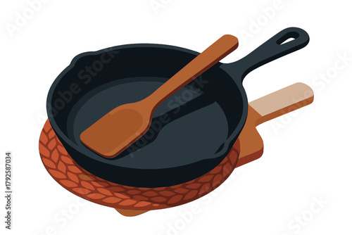 Cast iron skillet and wooden spatula on a round trivet and cutting board