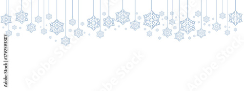 Winter holiday border or banner with pale blue hanging snowflakes of various sizes suspended by thin lines against a clean white background. Minimalist, cold-toned design suitable for winter.
