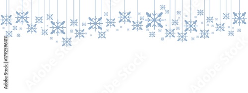 Winter holiday border or banner with pale blue hanging snowflakes of various sizes suspended by thin lines against a clean white background. Minimalist, cold-toned design suitable for winter.
