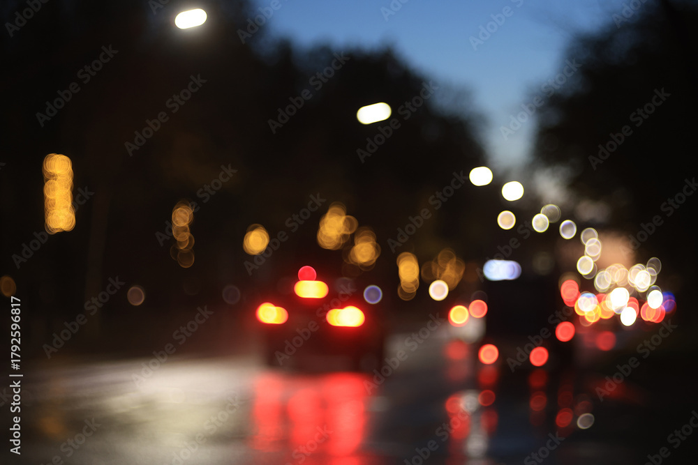 Fototapeta premium Night city blurred background, bokeh in autumn city traffic cars