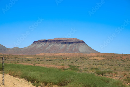 Panoramic view of a table mountain in the beautiful, typical Namibian landscape. Taken on the C13 between Helmeringhausen and Aus. Namibia, Africa.