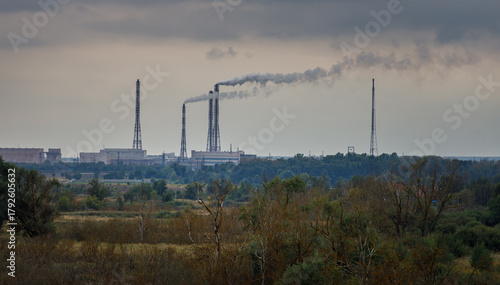Large industrial area with smoke coming out of the smokestacks