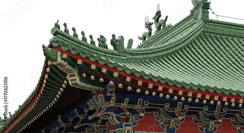 Close-up of a traditional Chinese temple roof with green tiles and ornate eaves, showcasing intricate architectural details and vibrant colors.
