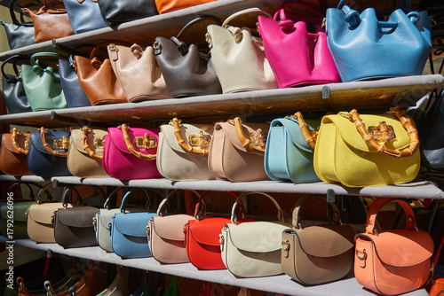 Close-up of women's leather handbags made in Italy, for sale at a street market