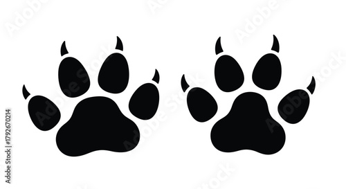 Two black animal paw prints displayed against a stark white background